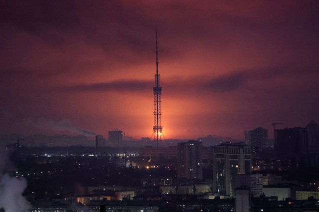 An explosion of a missile is seen in the sky over the city during a Russian missile strike, in Kyiv, Ukraine on March 21, 2024. (Photo by Gleb Garanich/Reuters)