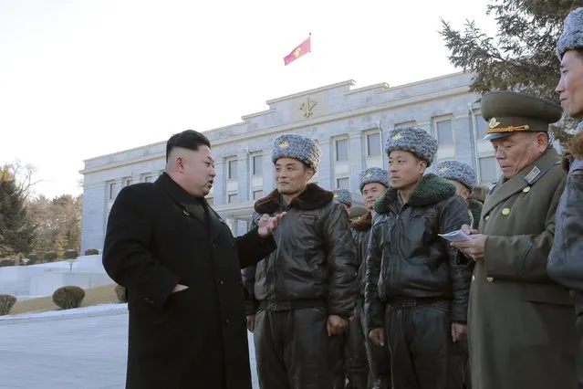 North Korean leader Kim Jong-un (L) speaks with fighter pilots during a photo session at the Workers' Party of Korea (WPK) Central Committee building in this undated photo released by North Korea's Korean Central News Agency (KCNA) in Pyongyang February 2, 2015. (Photo by Reuters/KCNA)