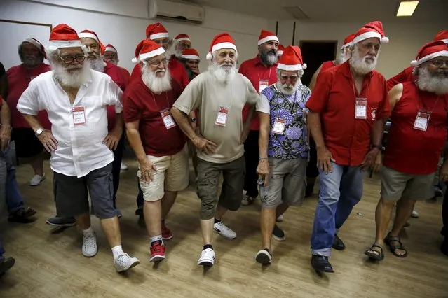 Students of the "Escola de Papai Noel do Brasil" (Brazil's school of Santa Claus) perform exercises during lessons in Rio de Janeiro, Brazil, October 27, 2015. The school, which was founded since 1993, prepare men to represent Santa Claus during the Christmas season. Lessons include singing, physical activity, how to dress and how to care for their beard. REUTERS/Pilar Olivares