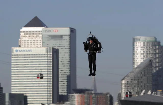 David Mayman pilots the JB-10 Jetpack over the Royal Victoria Docks in east London on its maiden flight in the UK on October 5, 2016. (Photo by Yui Mok/PA Wire)