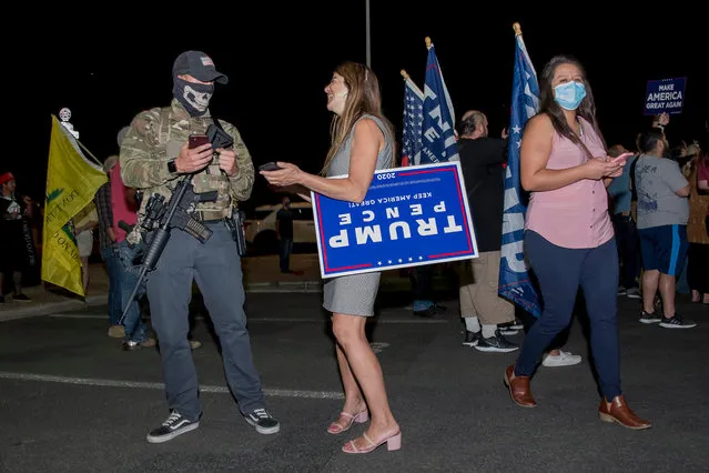 Trump supporters, including a small group of Second Amendment demonstrators, gather outside of the Maricopa County Recorder's Office to demand all ballots be counted in Phoenix, Arizona, USA, 05 November 2020. The 2020 US Presidential Election result remains undetermined as votes continued to be counted in several key battleground states. (Photo by Rick D’Elia/EPA/EFE)