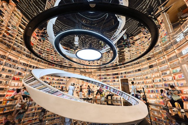 People visit a book store in Shenzhen, China's southern Guangdong province on July 21, 2025. (Photo by Adek Berry/AFP Photo)
