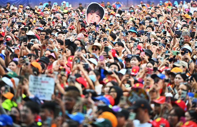 A fan holds up a sign in support of Yuki Tsunoda of Japan and Oracle Red Bull Racing prior to practice ahead of the F1 Grand Prix of Singapore at Marina Bay Street Circuit on October 03, 2025 in Singapore, Singapore. (Photo by Rudy Carezzevoli/Getty Images)