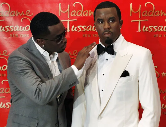 Sean “Diddy” Combs touches his wax figure at Madame Tussauds in New York, December 15, 2009. (Photo by Shannon Stapleton/Reuters)
