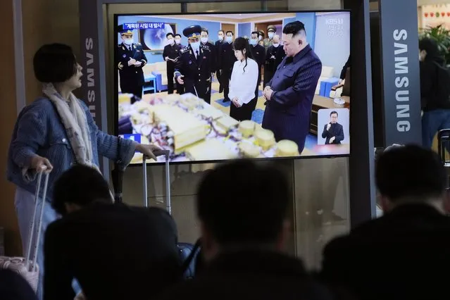 A TV screen shows an image of North Korean leader Kim Jong Un, right, and his daughter during a news program at the Seoul Railway Station in Seoul, South Korea, Wednesday, April 19, 2023. Kim said his country has completed the development of its first military spy satellite and ordered officials to go ahead with its launch as planned, state media reported Wednesday. (Photo by Ahn Young-joon/AP Photo)