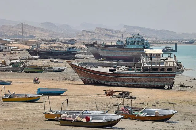 Traditional wooden ships (lenj) are pictured on Iran's touristic Qeshm island in the Gulf, on April 29, 2023. (Photo by Atta Kenare/AFP Photo)