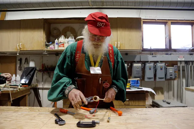 Santa Randy Schneider of Muskegon, Michigan learns wood toy making in the Gerace shop in Midland, Michigan, U.S. October 29, 2016. (Photo by Christinne Muschi/Reuters)