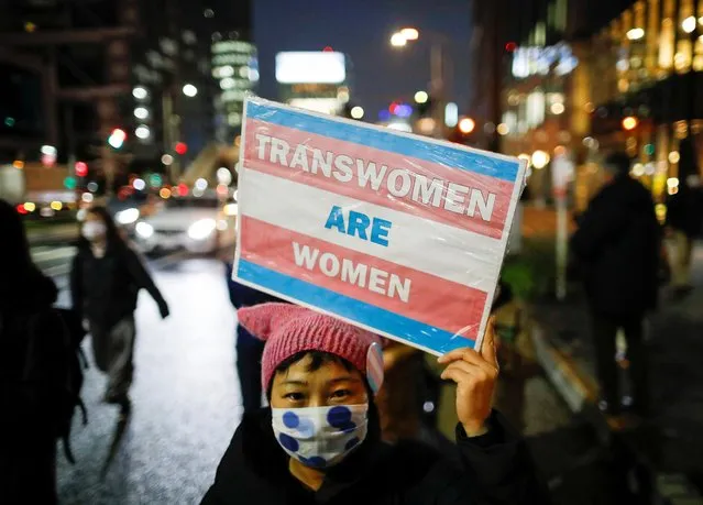 A demonstrator holds a placard while taking part in a march to call for gender equality and protest against gender discrimination, marking the International Women's Day in Tokyo, Japan on March 8, 2021. (Photo by Issei Kato/Reuters)