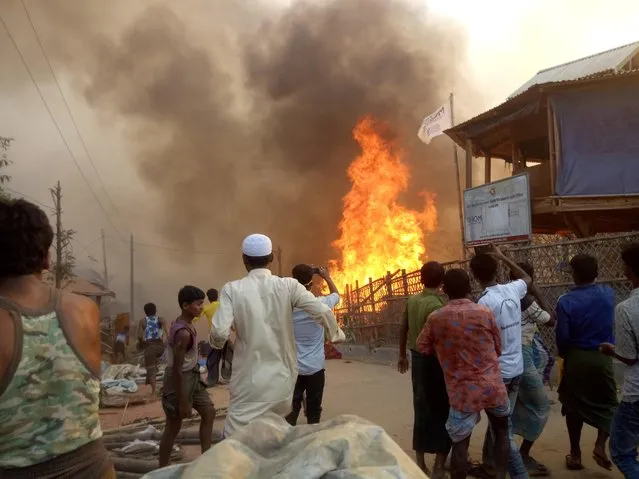 Fire is seen at Balukhali Refugee Camp, in Cox's Bazar, Bangladesh, March 22, 2021. (Photo by MD JAMAL PHOTOGRAPHY via Reuters)