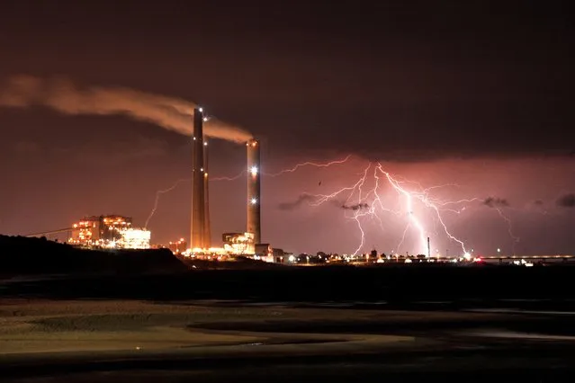 Rutenberg power station is seen as lightning strikes over the Mediterranean sea at the coastal city of Ashkelon, Israel on January 9, 2023. (Photo by Amir Cohen/Reuters)