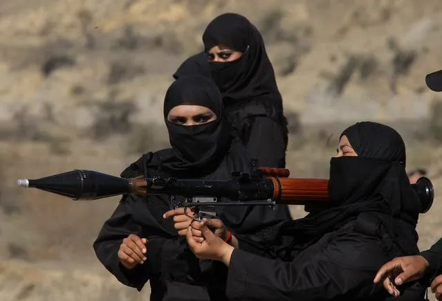 Pakistani female police commandos attend a training session in Nowshera, near Peshawar Pakistan, Wednesday, February 11, 2015. Authorities formed a Special Combat Unit after Taliban militants stormed a Peshawar school on Dec. 16, 2014 and massacred 150 children and teachers. (Photo by Mohammad Sajjad/AP Photo)