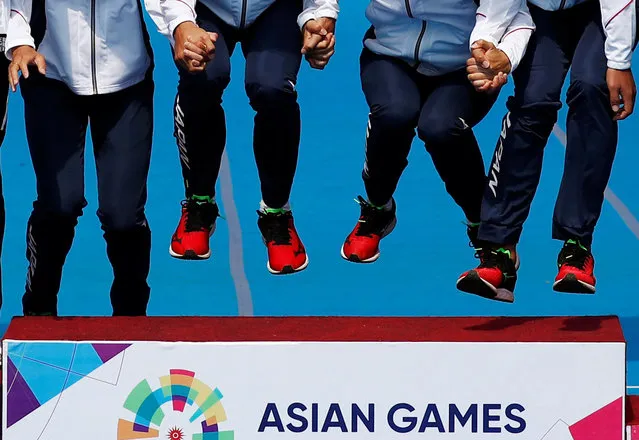 Gold medalists Team Japan jumps on the podium during the awards ceremony for the women' s team soft tennis event at the 2018 Asian Games in Palembang on September 1, 2018. (Photo by Edgar Su/Reuters)