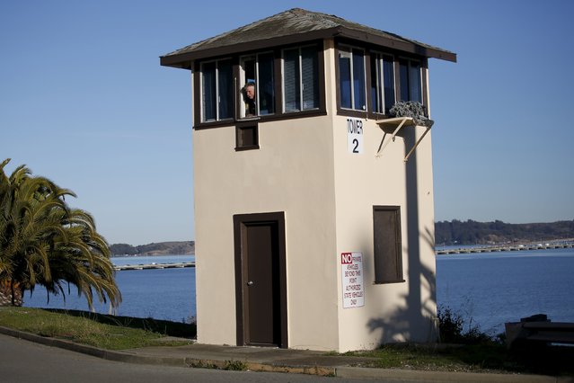 A guard looks out of a guard tower during a media tour of California's Death Row at San Quentin State Prison in San Quentin, California December 29, 2015. (Photo by Stephen Lam/Reuters)