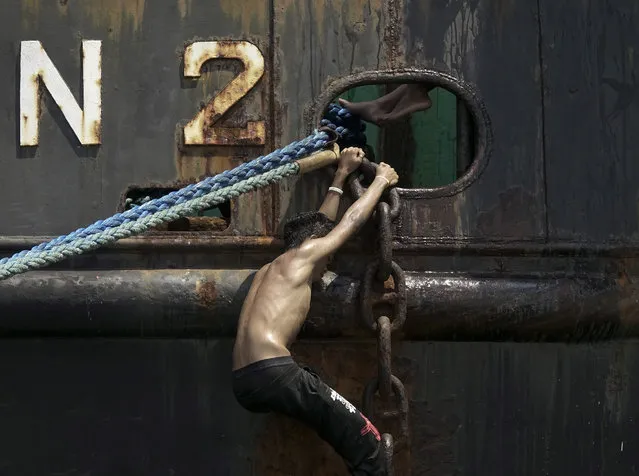 A Filipino climbs on an anchor chain of a cargo ship docked at the country's main seaport in Manila, Philippines, 24 September 2016. According to the International Maritime Bureau's latest sea crimes data, Southeast Asia recently accounts for the majority of seafaring attacks globally, surpassing the Horn of Africa. Pirates in Southeast Asia are increasingly hijacking ships, oil tankers and tugboats, stealing their cargoes, rob their crew and kidnap them for ransom, according to data from the International Chamber of Commerce’s International Maritime Bureau. (Photo by Francis R. Malasig/EPA)