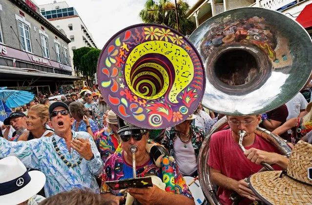 Florida Keys residents and visitors march along Duval Street in Key West, Florida, September 3, 2023, during a procession celebrating the life of internationally acclaimed singer/songwriter Jimmy Buffett. Buffett discovered Key West in the early 1970s and the island’s influence is widely credited with inspiring many of his most enduring songs, including his signature hit “Margaritaville”. .Buffett, best known for his 1977 hit “Margaritaville”, has died at age 76, according to a statement on his website. “Jimmy passed away peacefully on the night of September 1st (2023) surrounded by his family, friends, music and dogs”, the statement said. (Photo by Rob O'Neal/AP Photo)