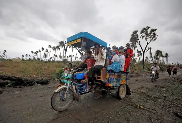 People come back to their villages after cyclone Tauktae hit, in Prachi village, in the western state of Gujarat, India, May 18, 2021. (Photo by Amit Dave/Reuters)