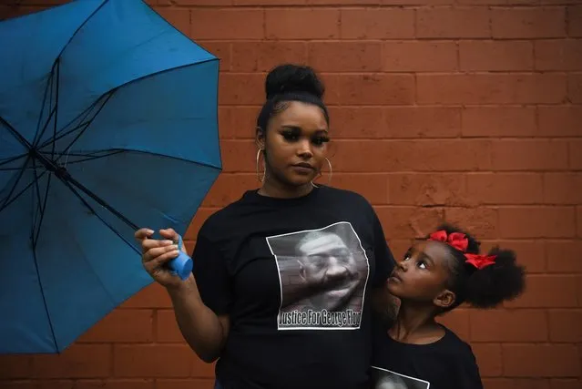 Mother and daughter Brittany and Brooklyn Elmore pose for a portrait in front of a mural of George Floyd ahead of the anniversary of Floyd’s death in Houston, Texas, U.S., May 23, 2021. (Photo by Callaghan O'Hare/Reuters)