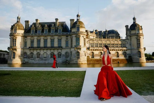 Models present creations by designer Pierpaolo Piccioli as part of his Haute Couture Fall/Winter 2023-2024 collection show for fashion house Valentino at the Chateau de Chantilly near Paris, France on July 5, 2023. (Photo by Sarah Meyssonnier/Reuters)