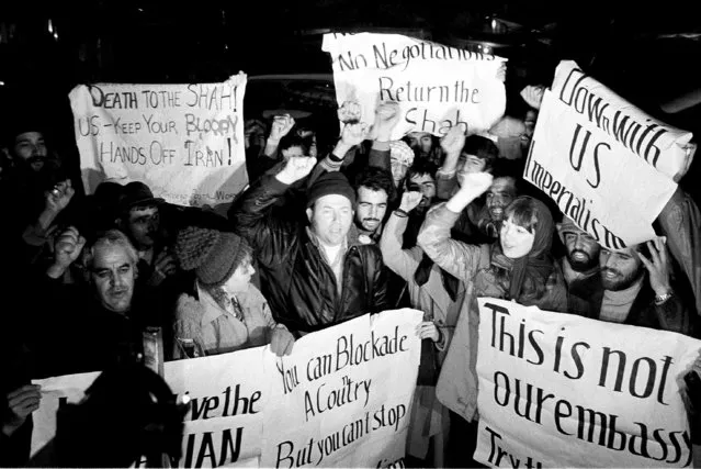 Americans who support Iran's position in the hostage crisis join with Iranians in anti-American demonstrations outside the U.S. Embassy in Tehran on December 15, 1979. (Photo by Mohammad Sayad/AP Photo)