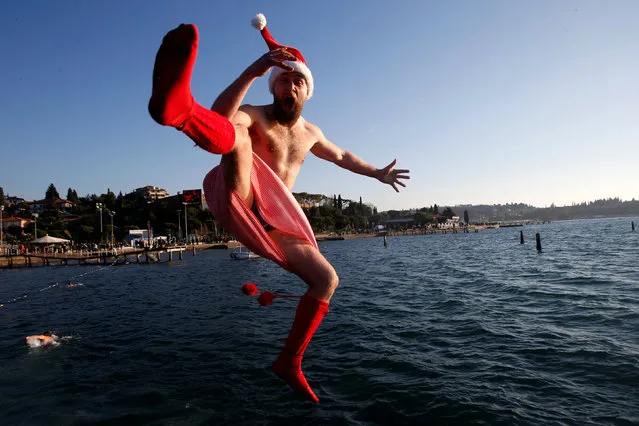 A man takes part in New Year's Jump into the Sea in Portoroz, Slovenia January 1, 2017. (Photo by Srdjan Zivulovic/Reuters)