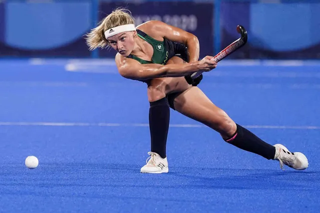 Ireland's Chloe Watkins passes the ball during a women's field hockey match against South Africa at the 2020 Summer Olympics, Saturday, July 24, 2021, in Tokyo, Japan. (Photo by John Minchillo/AP Photo)