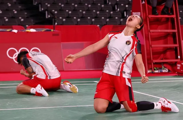 Indonesia's Greysia Polii and Indonesia's Apriyani Rahayu celebrate after winning their women's doubles badminton quarter final match against China's Li Yinhui and China's Du Yue during the Tokyo 2020 Olympic Games at the Musashino Forest Sports Plaza in Tokyo on July 29, 2021. (Photo by Leonhard Foeger/Reuters)
