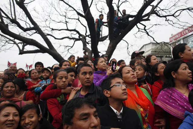 Nepalese devotees gather to watch the Seto Machindranath Chariot festival in Kathmandu, Nepal, Friday, March 27, 2015. (Photo by Niranjan Shrestha/AP Photo)