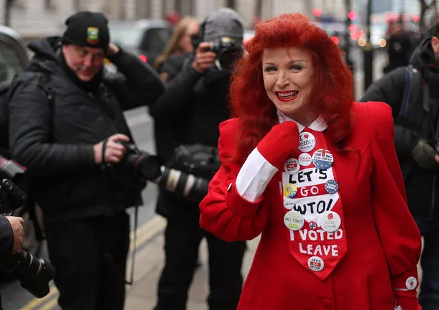 A pro-Brexit protester wearing “I Voted Leave” and other slogans on her tie poses for a photograph in London on January 23, 2019. British MPs frustrated with Prime Minister Theresa May's Brexit strategy are seeking to force a new approach, which could include delaying Britain's exit from the EU and holding a second referendum. (Photo by Daniel Leal-Olivas/AFP Photo)