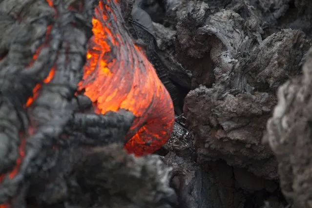 The molten lava from the Plosky Tolbachik volcano. (Photo by Denis Budkov/Caters News)