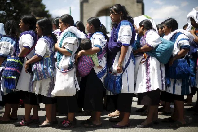 Indigenous women line up during a demonstration to mark International Women's Day at Revolucion monument in Mexico City, Mexico March 8, 2016. (Photo by Edgard Garrido/Reuters)