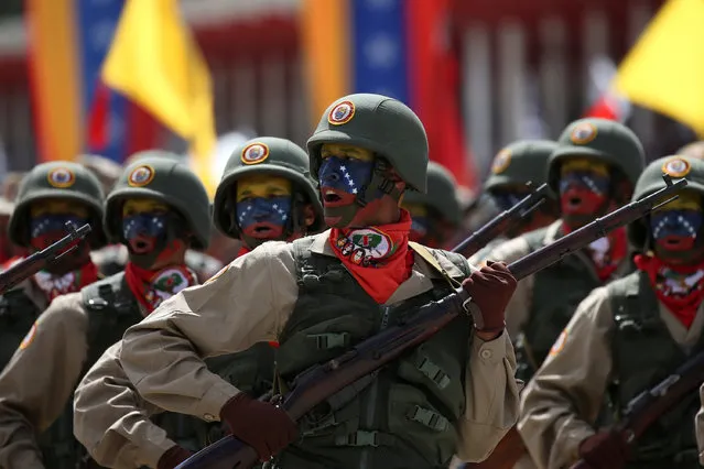 Militia members take part in a military parade in Caracas, Venezuela February 1, 2017. (Photo by Carlos Garcia Rawlins/Reuters)