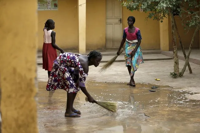 Women clean their premises at the Malkohi camp for Internally Displaced People camp in Yola, Adamawa State, Nigeria May 3, 2015. (Photo by Afolabi Sotunde/Reuters)