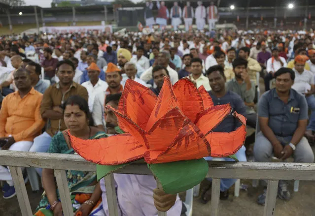 India's ruling Bharatiya Janata Party (BJP) supporters attend an election campaign rally in Hyderabad, India, Monday, April 1, 2019. India's general elections will be held in seven phases starting April 11. (Photo by Mahesh Kumar A./AP Photo)