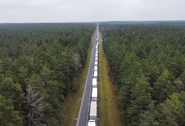 A drone photo shows trucks waiting in a queue of about 30 kilometers due to increase in controls and the transactions at the Bobrowniki border crossing while Polish police direct trucks to the Bobrowniki border gate after Poland's Kuznica border gate was closed for security reasons in Bobrowniki, Poland on November 15, 2021. (Photo by Abdulhamid Hosbas/Anadolu Agency via Getty Images)