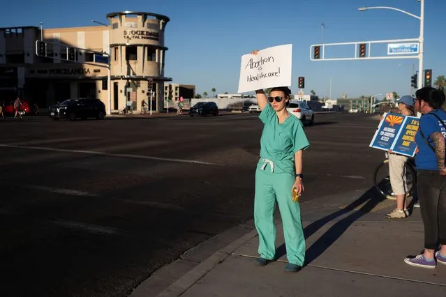 People protest in the district of Republican State Representative Matt Gress after Arizona's Supreme Court revived a law dating back to 1864 that bans abortion in virtually all instances, in Scottsdale, Arizona, U.S. April 14, 2024. (Photo by Rebecca Noble/Reuters)