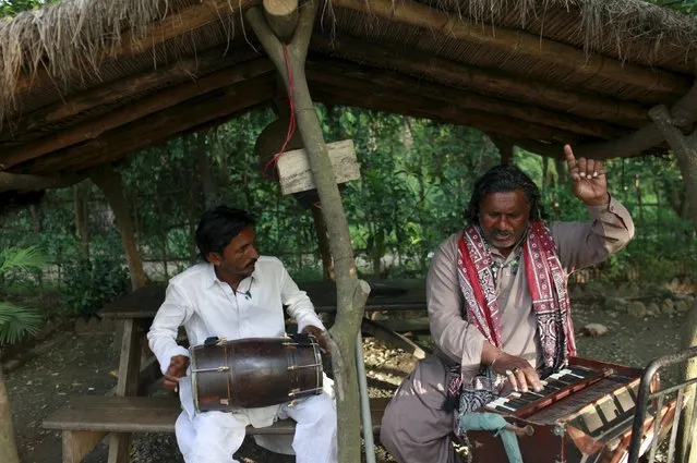 A folk artist from Sindh province sings at a roadside cafe in Islamabad April 21, 2015. (Photo by Sara Farid/Reuters)