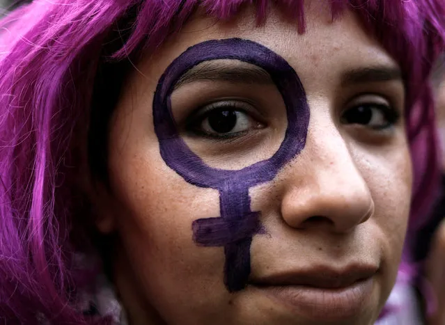 A demonstrator takes part in a march on International Women's Day in Sao Paulo, Brazil, March 8, 2017. (Photo by Nacho Doce/Reuters)