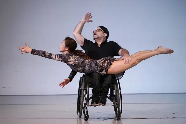 Sun Young Park, front, and Adam Eckstat, with Karen Peterson and Dancers, a physically integrated dance company, rehearse for a production titled SAMSARA, Tuesday, February 8, 2022, in Miami. The production explores the themes of disability, family dynamics and generational lineage. SAMSARA opens in Miami on Feb. 18 and 19. (Photo by Lynne Sladky/AP Photo)