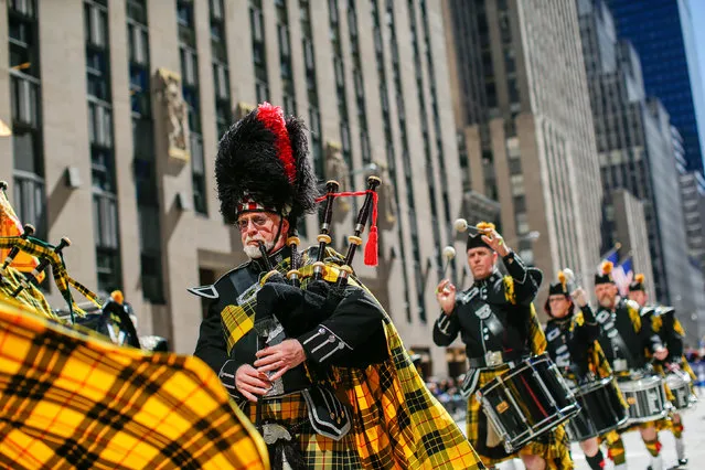 Pipers perform along 6av during the Annual Tartan Day Parade in New York, U.S. April 8, 2017. (Photo by Eduardo Munoz/Reuters)