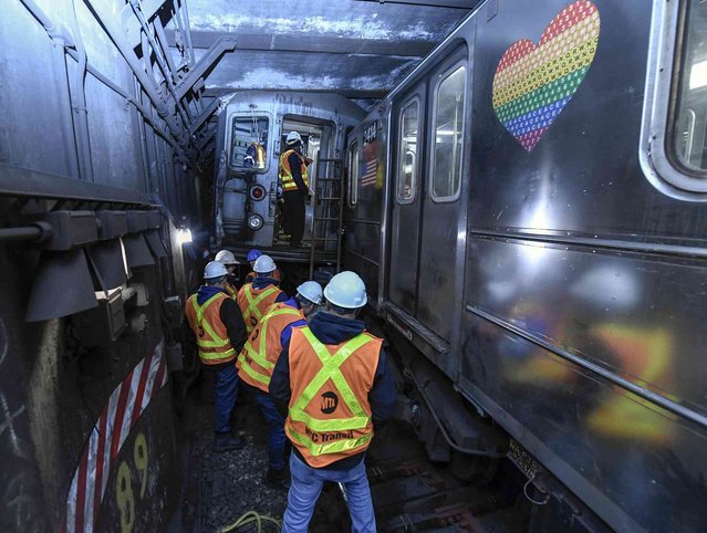 This photo provided by The Metropolitan Transportation Authority (MTA) shows emergency personnel at the scene of a train derailment of a New York City subway car, Thursday, January 4, 2024. A New York City subway train derailed Thursday after colliding with another train, leaving more than 20 people with minor injuries including some who were brought to hospitals, the New York City Police Department said. (Photo by Metropolitan Transportation Authority via AP Photo)
