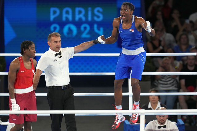 Panama's Atheyna Bylon, right, celebrates after defeating Refugee Olympic Team's Cindy Ngamba in their women's 75 kg semifinal boxing match at the 2024 Summer Olympics, Thursday, August 8, 2024, in Paris, France. (Photo by Ariana Cubillos/AP Photo)