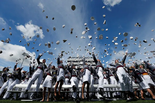 Graduates of the United States Military Academy toss their hats into the air at the conclusion of commencement ceremonies in West Point, New York, U.S., May 27, 2017. (Photo by Mike Segar/Reuters)