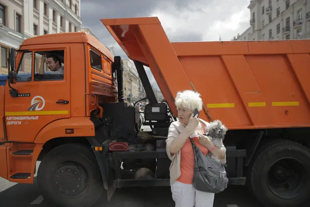 The Tverskaya street is blocked by trucks placed by authorities in Moscow, Russia, Monday, June 12, 2017. Russian opposition leader Alexei Navalny, aiming to repeat the nationwide protests that rattled the Kremlin three months ago, has called for the planned protest to be moved at the last minute, to Tverskaya street, one of Moscow's main thoroughfares, prompting a massive police presence in the area. (Photo by Pavel Golovkin/AP Photo)