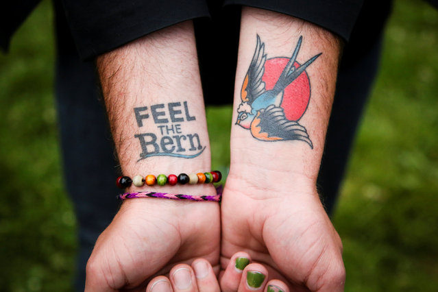 A supporter of Democratic U.S. presidential candidate Bernie Sanders shows off his Bernie tattoos at a campaign rally in San Francisco, California, U.S. June 6, 2016. (Photo by Elijah Nouvelage/Reuters)