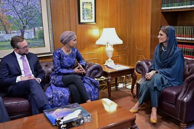 In this photo released by Press Information Department, U.S. Rep. Ilhan Omar, second left, meets with Hina Rabbani Khar, right, Pakistani Minister of State for Foreign Affairs in Islamabad, Pakistan, Wednesday, April 20, 2022. Omar met with Pakistan's president Wednesday during the first visit by a member of Congress since a new coalition government came into power in Islamabad last week after the ouster of former premier Imran Khan. (Photo by Press Information Department via AP Photo)