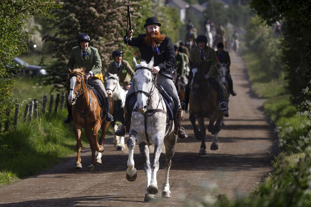 Riders gallop up the chase on the Nipknowes during the Common-Riding on June 9, 2023 in Hawick, Scotland. Hawick Common Riding is the first of the annual Border events, it celebrates the capture of an English Flag from a raiding party in 1514 by the youth of Hawick at Hornshole and the ancient custom of riding the marches or boundaries of the common land. (Photo by Jeff J. Mitchell/Getty Images)