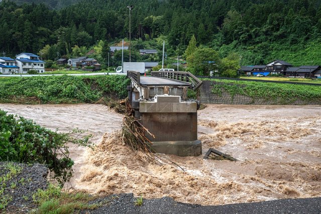 A collapsed bridge is seen following heavy rain in Wajima city, Ishikawa prefecture on September 22, 2024. Heavy rain lashed central Japan on September 22, with floods and landslides leaving one dead and at least six missing in an area already devastated by a major earthquake this year. (Photo by Yuichi Yamazaki/AFP Photo)