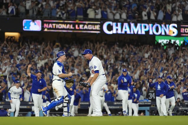 Los Angeles Dodgers pitcher Blake Treinen and catcher Will Smith celebrate their win against the New York Mets in Game 6 of a baseball NL Championship Series, Sunday, October 20, 2024, in Los Angeles. (Photo by Julio Cortez/AP Photo)