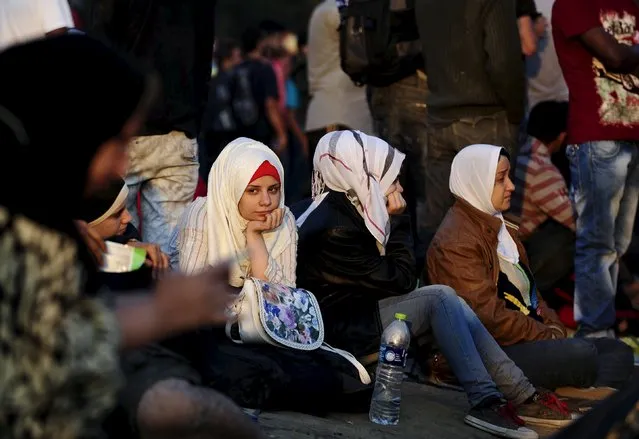 A new group of more than a thousand immigrants wait at the border line of Macedonia and Greece to enter into Macedonia near Gevgelija railway station August 20, 2015. (Photo by Ognen Teofilovski/Reuters)