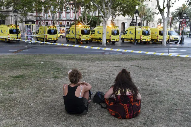 People look toward the scene of a terrorist attack in the Las Ramblas area on August 17, 2017 in Barcelona, Spain. Officials say 13 people are confirmed dead and at least 50 injured after a van plowed into people in the Las Ramblas area of the city.  (Photo by David Ramos/Getty Images)